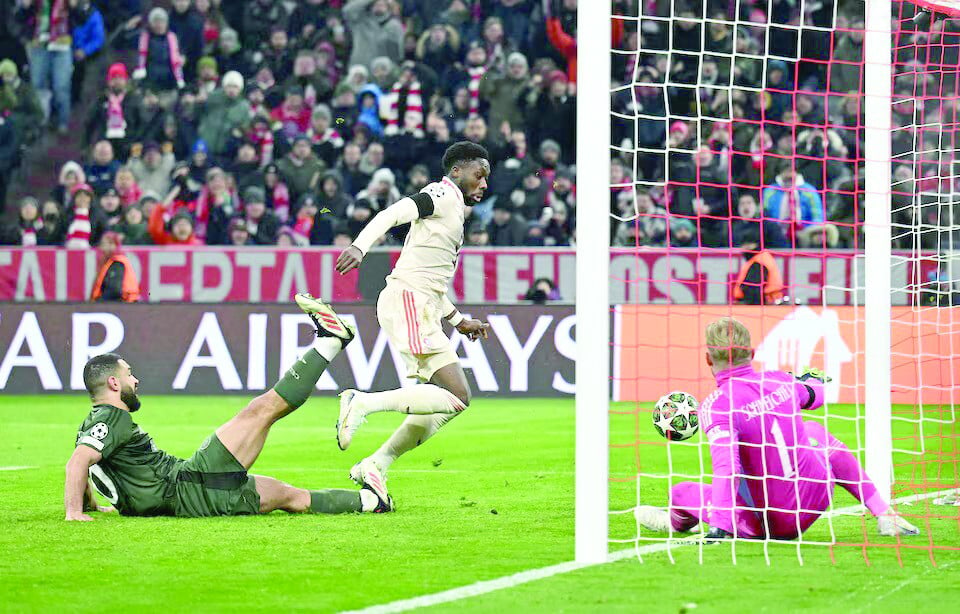 bayern munich s alphonso davies scores their second goal past celtic s kasper schmeichel during the champions league knockout phase playoff second leg at allianz arena on february 18 photo reuters