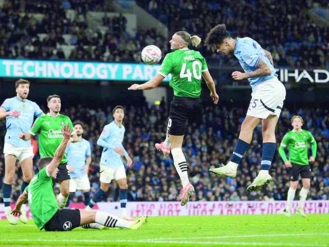 manchester city s nico o reilly scores their second goal during the fa cup fifth round match with plymouth argyle at etihad stadium manchester on march 1 photo reuters manchester city s nico o reilly scores their second goal during the fa cup fifth round match with plymouth argyle at etihad stadium manchester on march 1 photo reuters