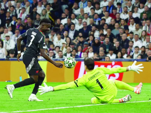 arsenal s bukayo saka scores their first goal during the champions league quarter final second leg against real madrid at santiago bernabeu madrid on april 16 photo reuters arsenal s bukayo saka scores their first goal during the champions league quarter final second leg against real madrid at santiago bernabeu madrid on april 16 photo reuters