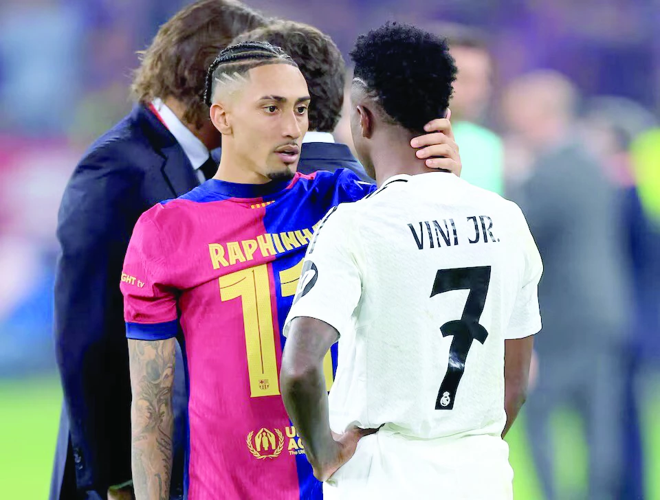 fc barcelona s raphinha with real madrid s vinicius junior after the copa del rey final at estadio de la cartuja seville spain on april 2 photo reuters fc barcelona s raphinha with real madrid s vinicius junior after the copa del rey final at estadio de la cartuja seville spain on april 2 photo reuters