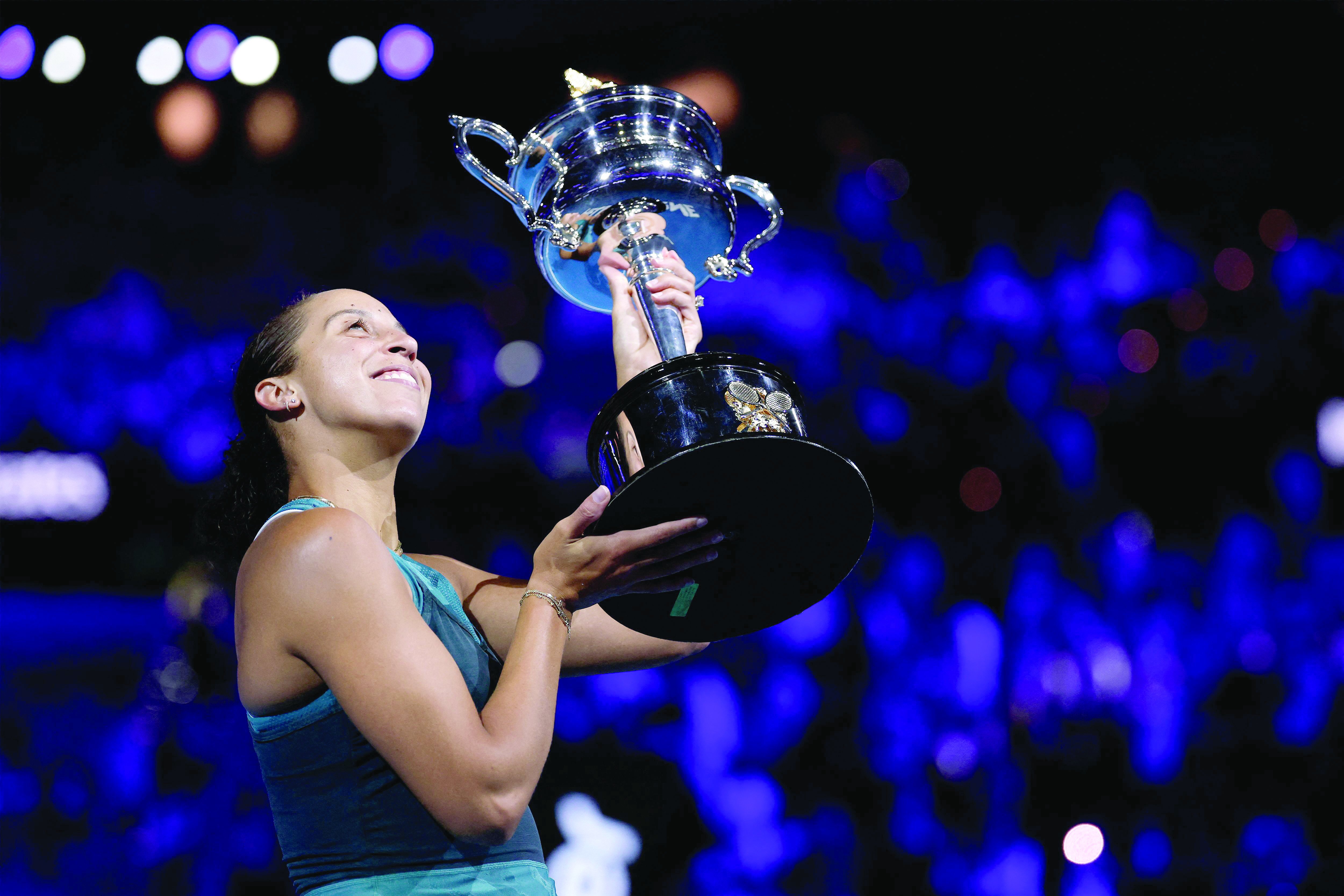 madison keys celebrates with the daphne akhurst memorial cup after defeating aryna sabalenka during their final match on day fourteen of the australian open on january 25 photo afp