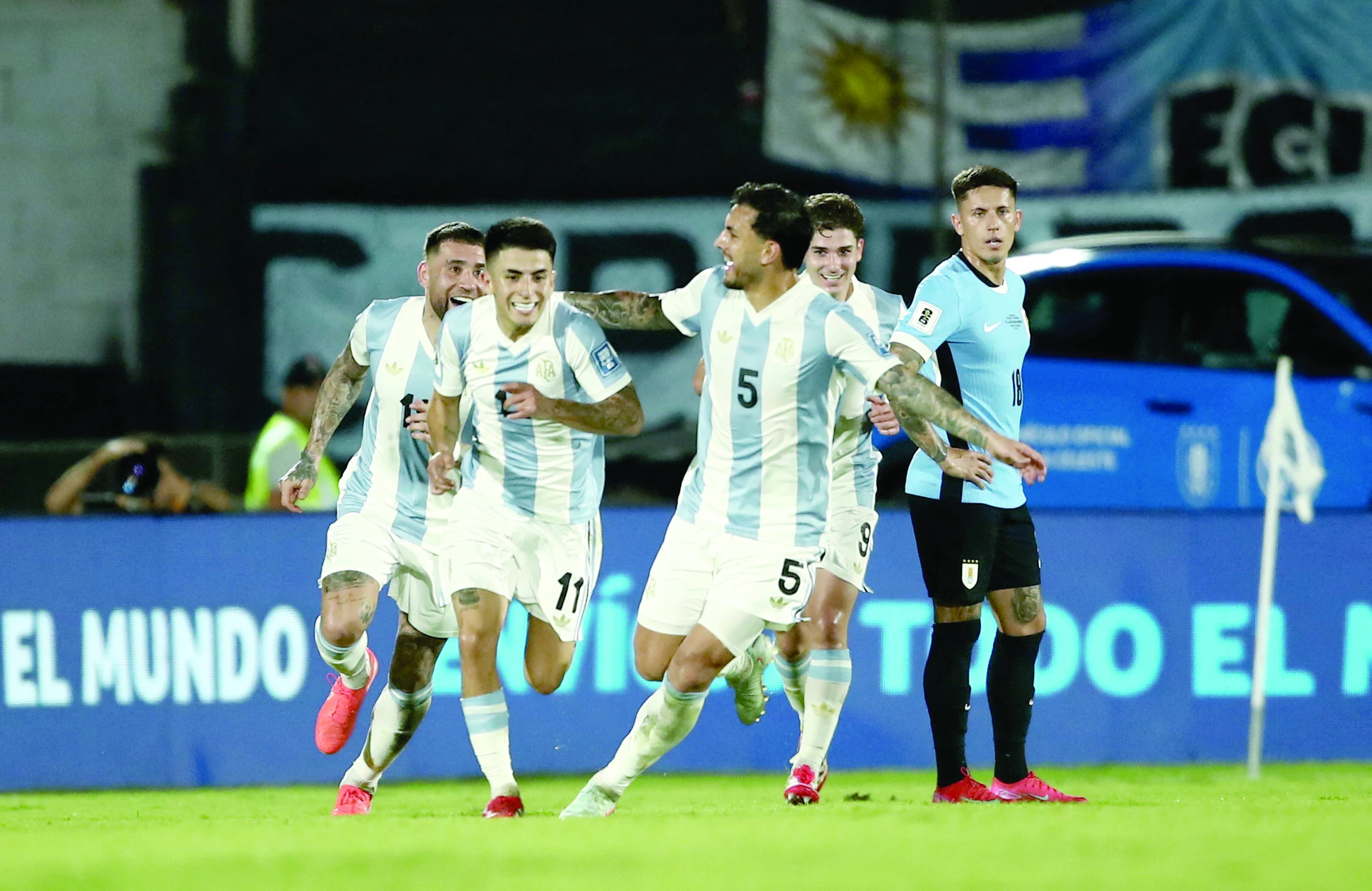 argentina s thiago almada celebrates scoring their first goal with teammates during the world cup south american qualifiers against uruguay at estadio centenario montevideo uruguay on march 21 photo reuters argentina s thiago almada celebrates scoring their first goal with teammates during the world cup south american qualifiers against uruguay at estadio centenario montevideo uruguay on march 21 photo reuters