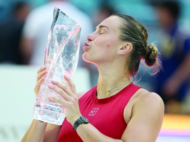 aryna sabalenka celebrates with the butch buchholz trophy following her victory against jessica pegula in the miami open women s final at hard rock stadium photo afp