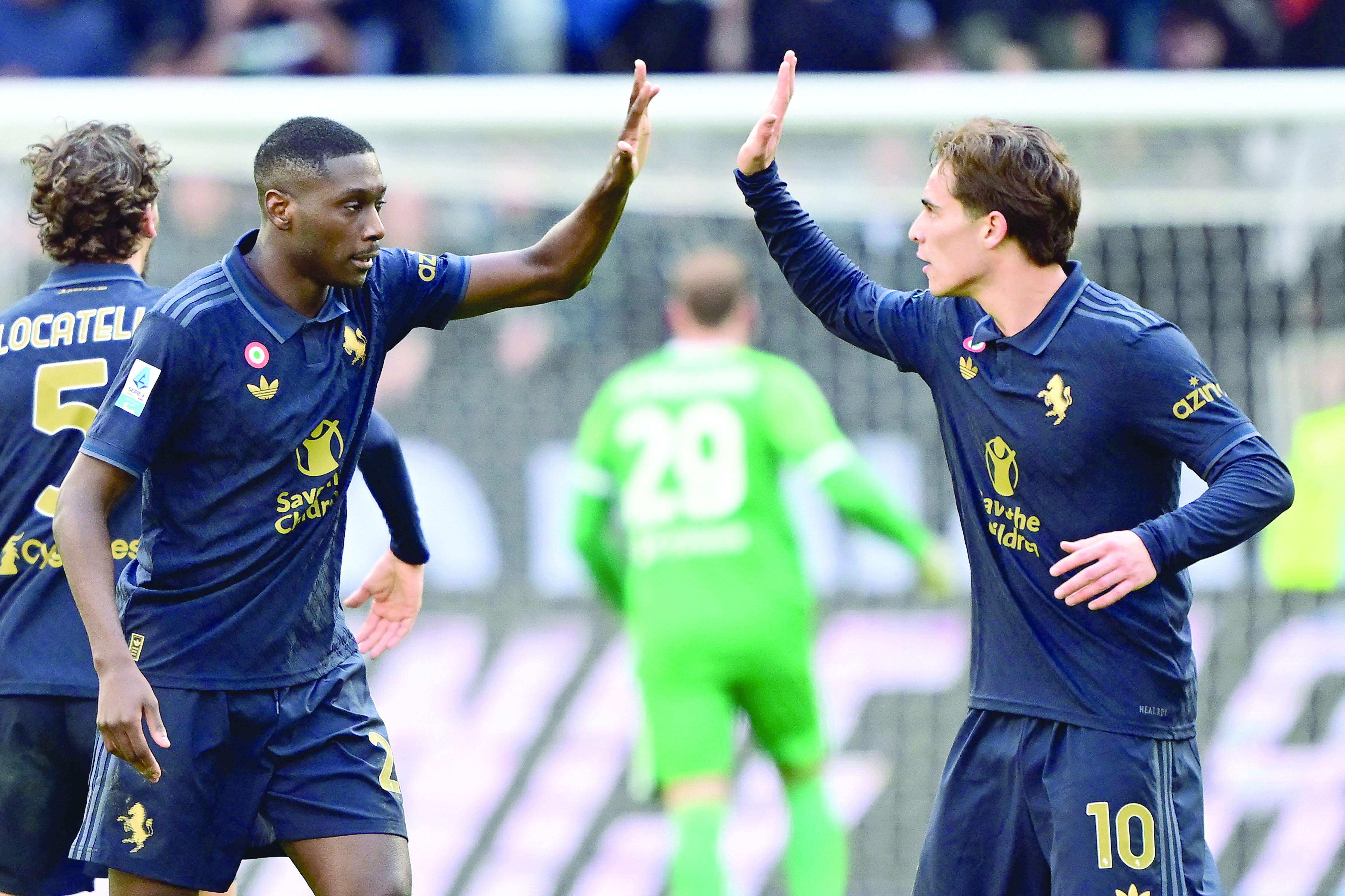 juventus defender randal kolo muani celebrates after scoring a goal with midfielder kenan yildiz during the italian serie a match against empoli at the allianz stadium in turin on february 2 photo afp