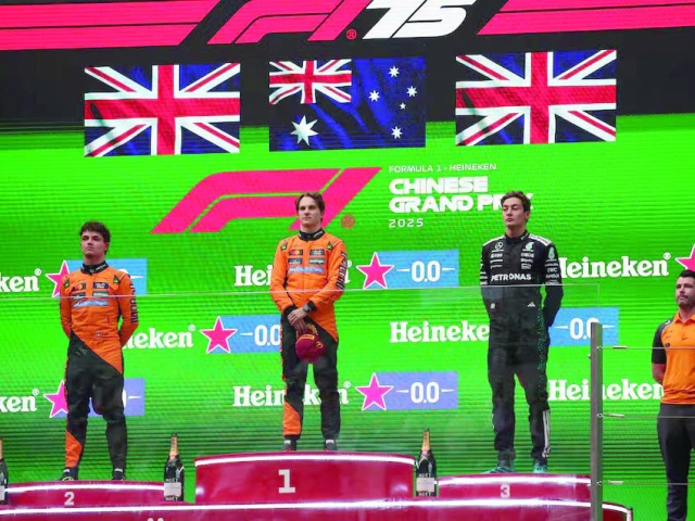 mclaren s oscar piastri stands on the podium during the national anthems after winning the chinese grand prix alongside second placed mclaren s lando norris and third placed mercedes george russell photo reuters mclaren s oscar piastri stands on the podium during the national anthems after winning the chinese grand prix alongside second placed mclaren s lando norris and third placed mercedes george russell photo reuters