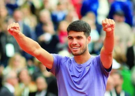 carlos alcaraz celebrates after winning his monte carlo masters final against italy s lorenzo musetti at monte carlo country club roquebrune cap martin france on april 13 photo reuters