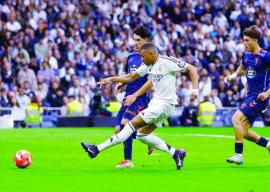 real madrid s kylian mbappe scores their third goal during the laliga match with celta vigo at santiago bernabeu madrid photo reuters