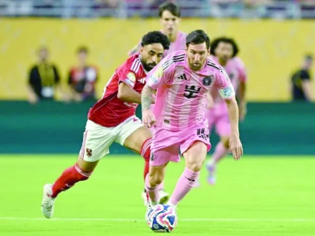 al ahly s marwan attia and inter miami s lionel messi fight for the ball during the opening game of the club world cup photo afp al ahly s marwan attia and inter miami s lionel messi fight for the ball during the opening game of the club world cup photo afp