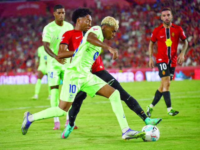 fc barcelona s lamine yamal in action with rcd mallorca s johan mojica photo reuters fc barcelona s lamine yamal in action with rcd mallorca s johan mojica photo reuters