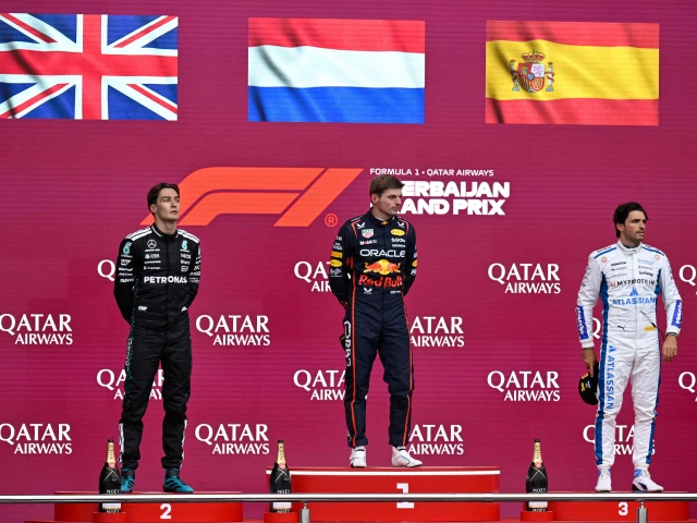 winner red bull s max verstappen c second placed mercedes george russell l and third placed carlos sainz r pose after the formula one azerbaijan grand prix photo afp
