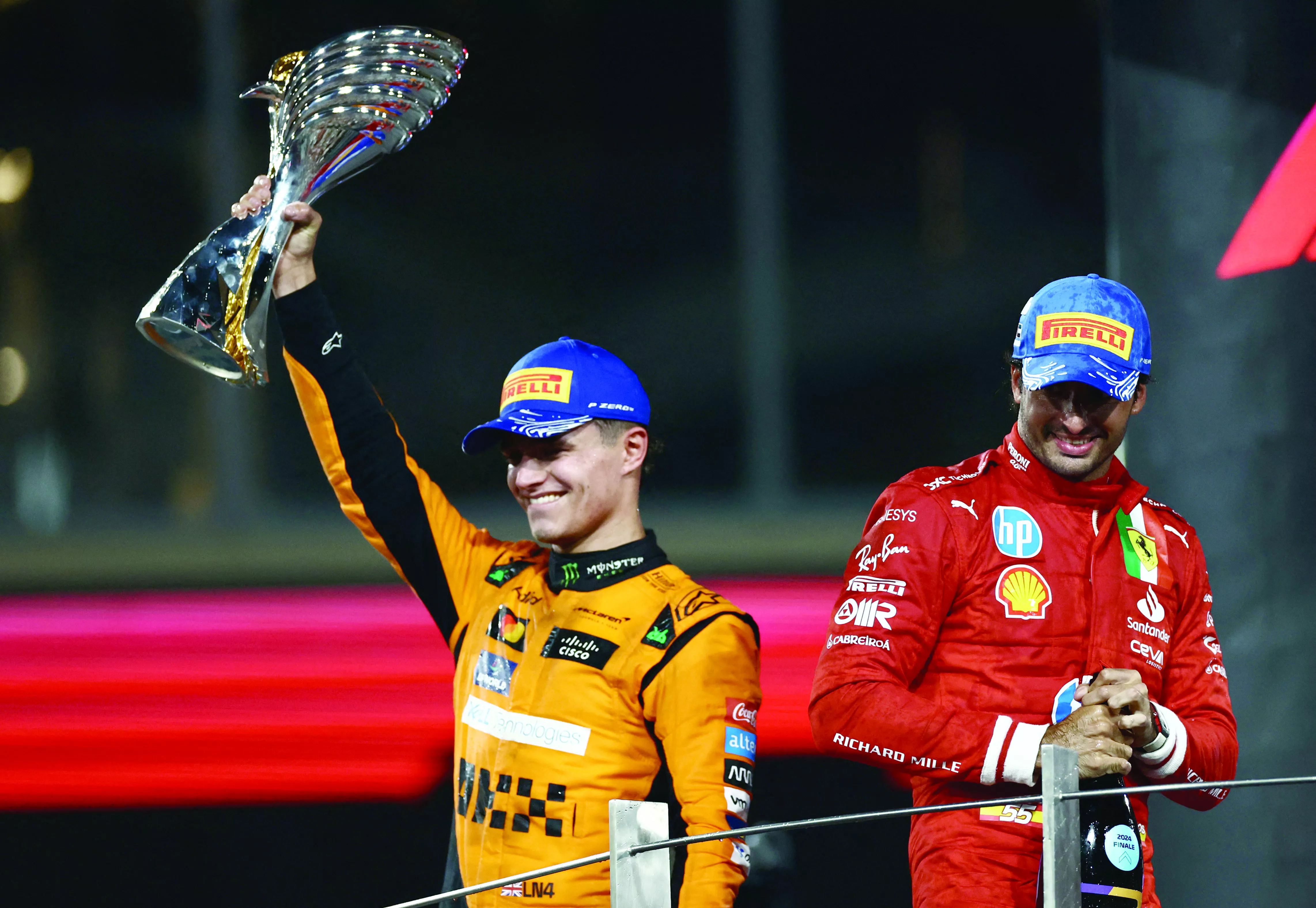 spectacular mclaren s lando norris celebrates on the podium with the trophy after winning the abu dhabi grand prix at yas marina circuit photo reuters spectacular mclaren s lando norris celebrates on the podium with the trophy after winning the abu dhabi grand prix at yas marina circuit photo reuters
