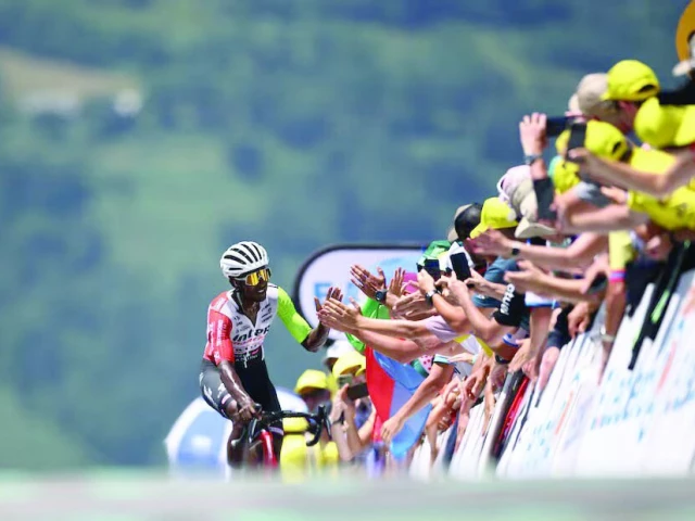 wanty s biniam girmay with spectators before crossing the finish line of tour de france stage 13 photo reuters