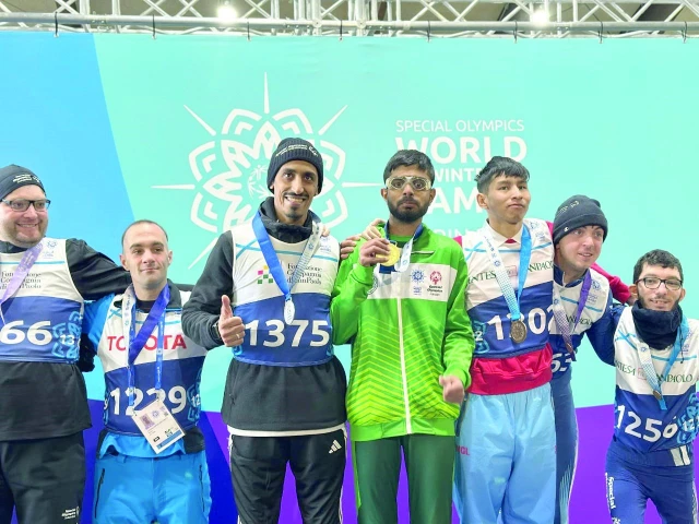 special olympics pakistan athlete poses at the podium with others at the special olympics world winter games in turin with his gold medal photo courtesy sop special olympics pakistan athlete poses at the podium with others at the special olympics world winter games in turin with his gold medal photo courtesy sop