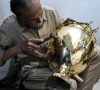 restorer shakeel ahmed works on an antique at his workshop in rawalpindi photo afp