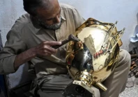 restorer shakeel ahmed works on an antique at his workshop in rawalpindi photo afp restorer shakeel ahmed works on an antique at his workshop in rawalpindi photo afp