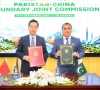 bilal mahmood chaudhary director general china at the ministry of foreign affairs and li ya deputy director general of the department of boundary and ocean affairs at china s ministry of foreign affairs pose for a photograph after signing the minutes of the inaugural pakistan china boundary joint commission meeting in islamabad photo fo