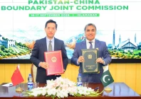 bilal mahmood chaudhary director general china at the ministry of foreign affairs and li ya deputy director general of the department of boundary and ocean affairs at china s ministry of foreign affairs pose for a photograph after signing the minutes of the inaugural pakistan china boundary joint commission meeting in islamabad photo fo