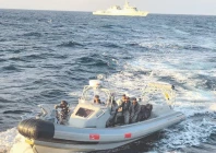 a boat of the pakistan navy evacuates a sri lankan citizen requiring urgent medical attention on an indonesian flagged merchant vessel photo online