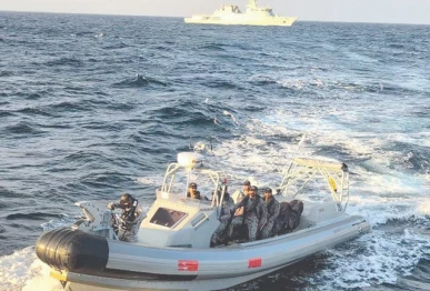 a boat of the pakistan navy evacuates a sri lankan citizen requiring urgent medical attention on an indonesian flagged merchant vessel photo online