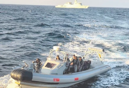 a boat of the pakistan navy evacuates a sri lankan citizen requiring urgent medical attention on an indonesian flagged merchant vessel photo online
