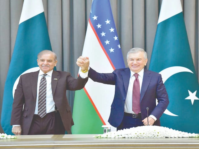 pm shehbaz sharif and uzbekistan president shavkat mirziyoyev raise hands in solidarity during the joint press stakeout in tashkent photo ppi