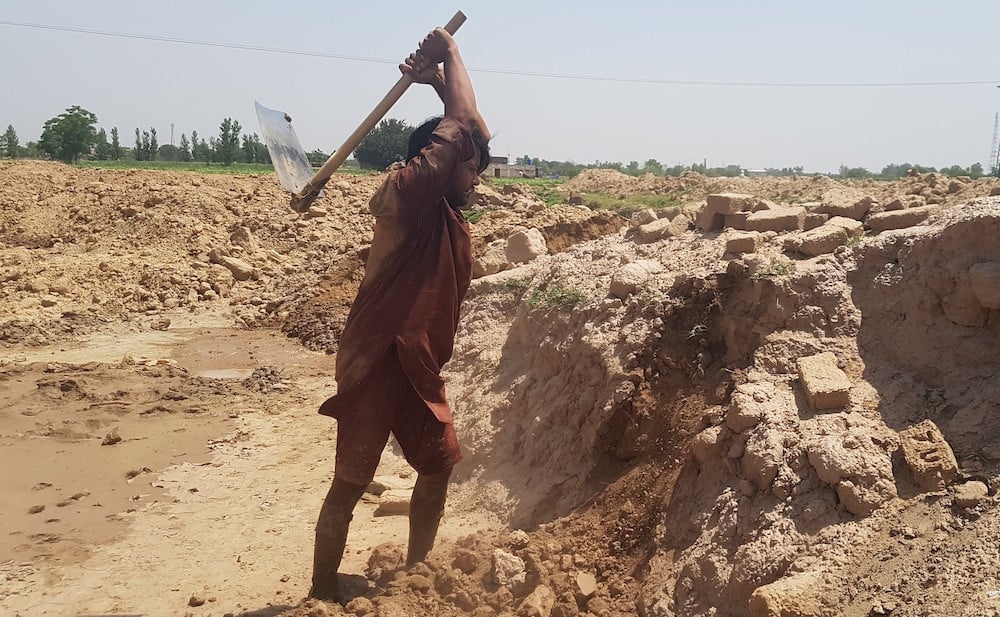 A male kiln worker works his way through a harsh heatwave.