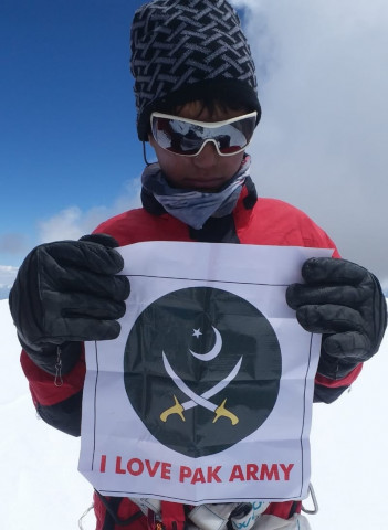 the young mountaineers displayed the banners of pakistan army and leadership to pay homage to their services photo express