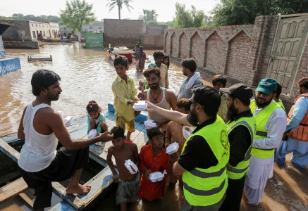 volunteers distribute food packets to villagers in flood affected areas as the sutlej river swelled following heavy rains on the outskirts of multan in punjab province on september 5 2025 photo afp volunteers distribute food packets to villagers in flood affected areas as the sutlej river swelled following heavy rains on the outskirts of multan in punjab province on september 5 2025 photo afp