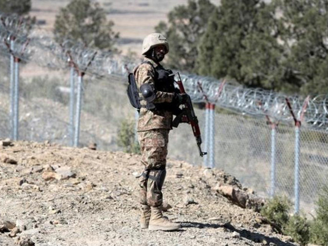 a pakistan army soldier stands guard at the afghan border photo file