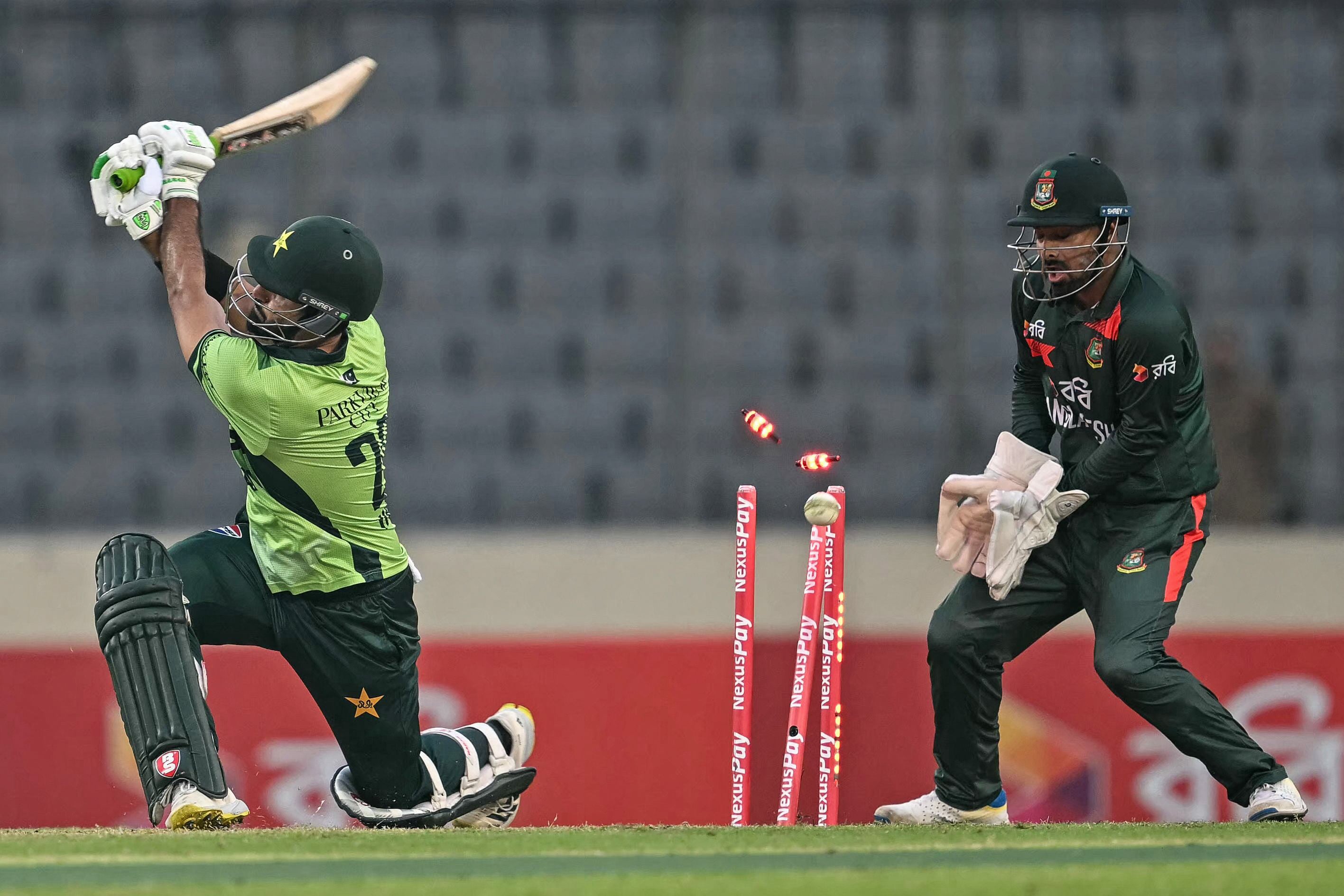 Pakistan's Hussain Talat (L) is clean bowled by Bangladesh's Rishad Hossain during the second one-day international (ODI) cricket match between Bangladesh and Pakistan at Sher-e-Bangla National Stadium in Mirpur on March 13, 2026. Photo: AFP