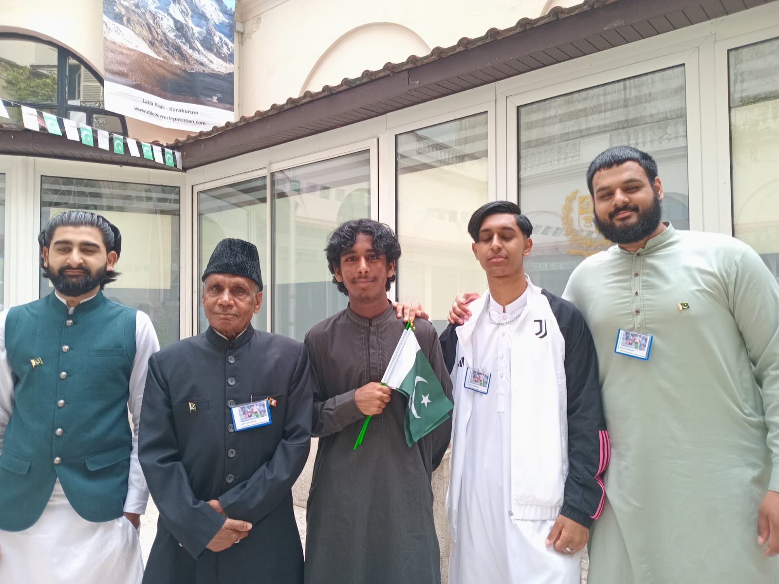 french pakistani national raja karamat ali and his grandsons display arshad nadeem s badges during the independence day celebrations in paris photo natasha raheel