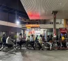 people on their motorbikes wait for their turn to get fuel at a petrol station hours before fuel prices are raised in pakistan amid the u s  israeli conflict with iran in karachi pakistan april 30 2026 picture taken with a mobile phone reuters