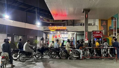 people on their motorbikes wait for their turn to get fuel at a petrol station hours before fuel prices are raised in pakistan amid the u s  israeli conflict with iran in karachi pakistan april 30 2026 picture taken with a mobile phone reuters
