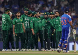 pakistan players wait for a video review on a potential dismissal for india s suryakumar yadav photo reuters