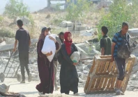 palestinians carry humanitarian aid in gaza strip photo afp