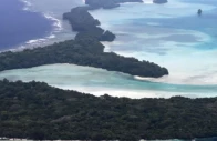 an aerial view of small islands off the coast of koror the capital of palau scattered across the turquoise waters of the pacific ocean photo afp