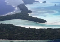 an aerial view of small islands off the coast of koror the capital of palau scattered across the turquoise waters of the pacific ocean photo afp