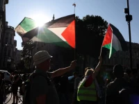 people wave palestinian flags during a protest after british lawmakers voted to ban pro palestinian campaign group palestine action as a terrorist organization outside downing street in london britain july 2 2025