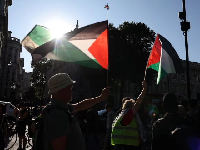 people wave palestinian flags during a protest after british lawmakers voted to ban pro palestinian campaign group palestine action as a terrorist organization outside downing street in london britain july 2 2025 people wave palestinian flags during a protest after british lawmakers voted to ban pro palestinian campaign group palestine action as a terrorist organization outside downing street in london britain july 2 2025