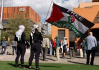 protesters wearing keffiyehs wave a pro palestinian flag during a protest against the ice detention of palestinian activist and columbia university graduate student mahmoud khalil near arizona state university asu in phoenix arizona u s march 15 2025 photo reuters