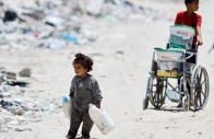 palestinian children trek through the rubbles to fetch water photo reuters file palestinian children trek through the rubbles to fetch water photo reuters file