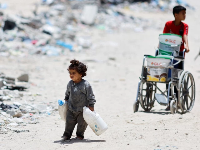 palestinian children trek through the rubbles to fetch water photo reuters file palestinian children trek through the rubbles to fetch water photo reuters file