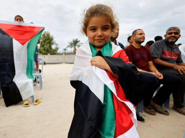 a girl holds a palestinian flag after us president donald trump announced that israel and hamas agreed on the first phase of a gaza ceasefire in the central gaza strip october 9 2025 photo reuters a girl holds a palestinian flag after us president donald trump announced that israel and hamas agreed on the first phase of a gaza ceasefire in the central gaza strip october 9 2025 photo reuters