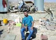 basel adra holds up his oscar in the village of at tuwani in the occupied west bank photo al monitor basel adra holds up his oscar in the village of at tuwani in the occupied west bank photo al monitor