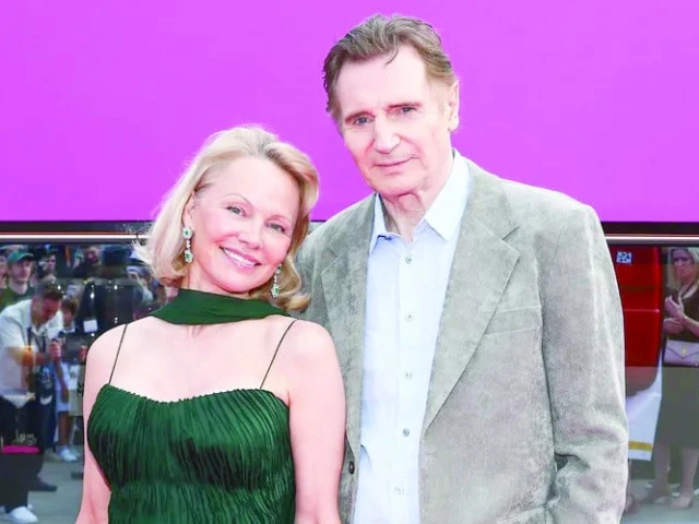 pamela anderson and liam neeson at the german premiere of the naked gun photo reuters pamela anderson and liam neeson at the german premiere of the naked gun photo reuters