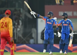 ndia s hardik pandya c celebrates after scoring his half century 50 runs as teammate tilak varma r looks on during the 2026 icc men s t20 cricket world cup super eights match between india and zimbabwe at the ma chidambaram stadium in chennai on february 26 2026 photo afp