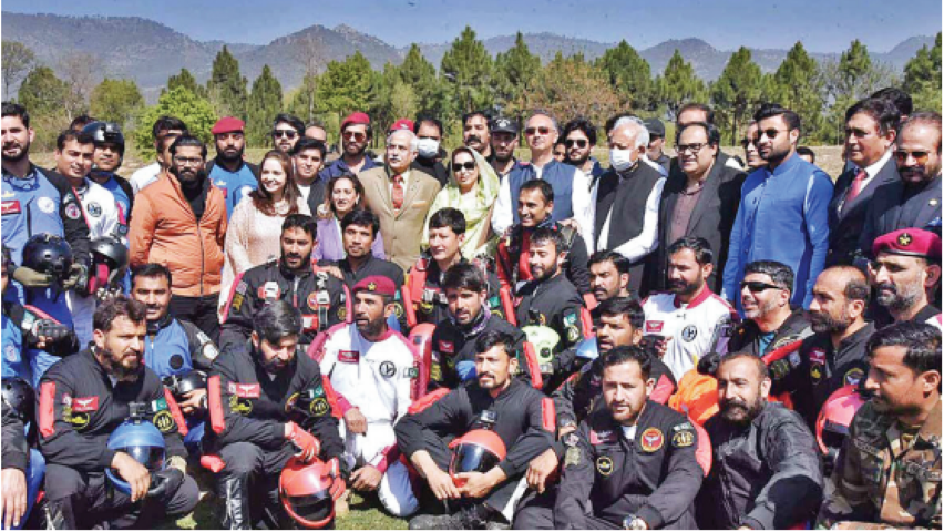 adventure enthusiasts photographed with paragliders and skydivers are federal ministers ghulam sarwar khan omar ayub and zulfiqar bukhari at the inaugural ceremony of the islamabad tourism festival at fatima jinnah park photo app