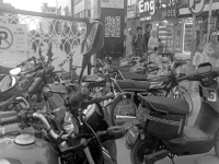 serial violators despite a clear ban on parking at the entrance gate of newly opened pedestrian only street in raja bazaar and a warning that violators will be fined rs2 000 motorcycles continue to be parked at the site photo express