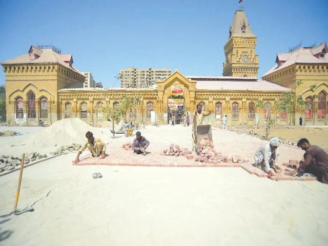 labourers install paver blocks at the front side of empress market transforming the space into a parking area photo ppi