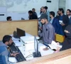 people crowding the facilitation desk to receive their passports photo app file